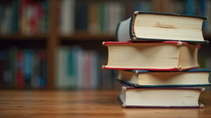 a-stack-of-books-on-a-wooden-desk-with-a-copyright-symbol-beside-them-
